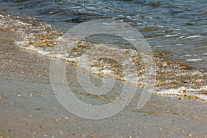 Wave on the sand beach.