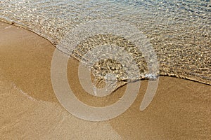 Wave on the sand beach