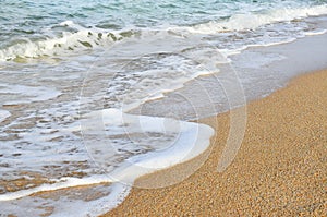 Wave of the sea on the sand beach