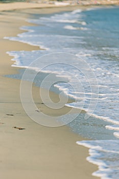 Wave of the sea on the sand beach