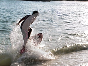 Wave skim boarding photo