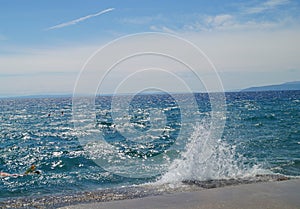 Wave splash on beautiful blue adriatic sea