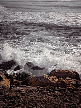 Wave splash hitting a rocky coast