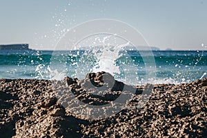 Wave splashing over rocks in Baleal