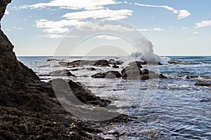 Wave splashing on the rocks photo