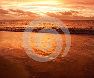 A wave during a sunset after a storm in Tonga