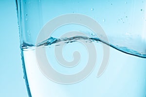 wave of water in a glass vessel. clean clear water