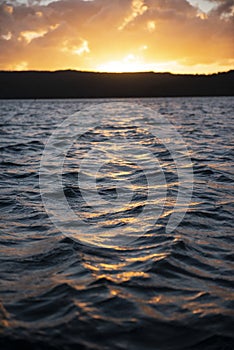 Wave water surface with sunset