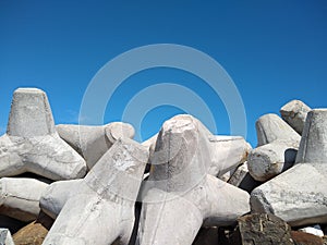 wavelet blocks on the beach, blue sky background, vizhinjam Harbor, Thiruvananthapuram Kerala