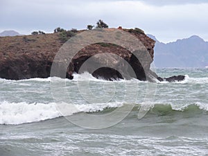 Waves against Cave island