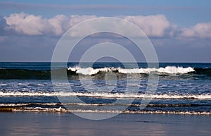 Waves along the beach in summer