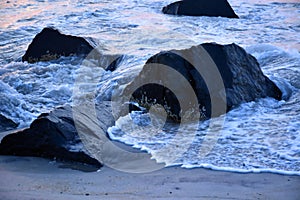 Waves Along the Jetty at Sunrise