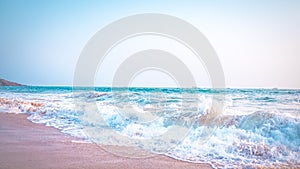 Waves of the Arabian Sea at the Anjuna beach by sunset, Goa, India