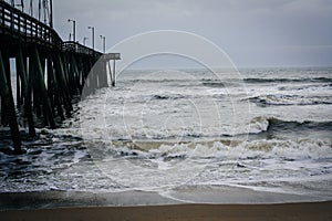 Waves in the Atlantic Ocean and the Fishing Pier in Virginia Beach, Virginia.