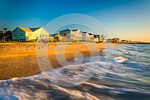 Waves in the Atlantic Ocean and morning light on beachfront home