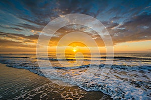 Waves in the Atlantic Ocean and sunrise, in Isle of Palms, South Carolina