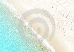 Waves on the beach as a background. Beautiful natural background at the summer time-above view