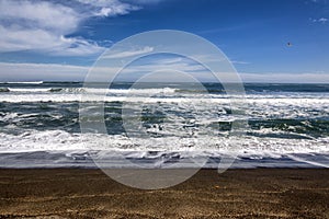 Waves on the beach of Cobquecura, Chile photo