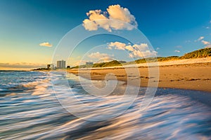 Waves on the beach at Coral Cove Park at sunrise, Jupiter Island