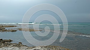 Waves at Beach in Italy, Mediterranean Sea view. Cloudy Skies over Sea