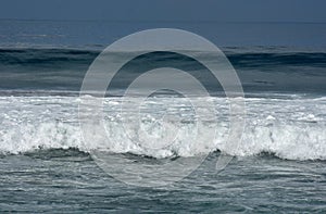 waves on the beach of kuta bali