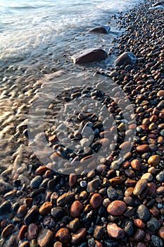 Waves on the beach of round stones