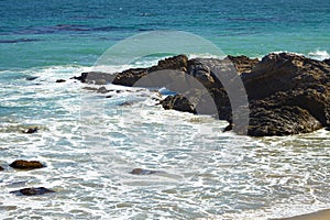 Waves beating against coastal rocks on the cliffs