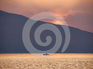 Waves and beautiful sunset on the Greek island Evia Euboea in the Aegean Sea