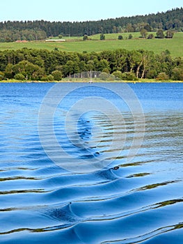 Waves behind the ship on Lipno Lake