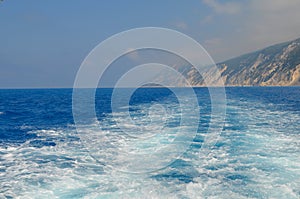 waves are being formed behind a boat.