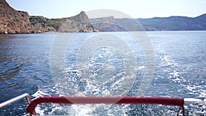 waves of a boat on the blue sea with splashes and a wake from a yacht. Travel and journey concept