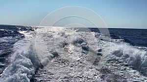 Waves from a boat on the sea