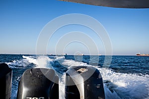 the waves of a boat in the sea at karang panambungan island