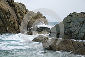 Waves braking on rocks