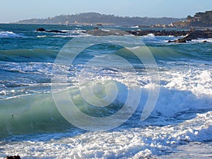 Waves Break along beach path at Carmel-by-the-Sea