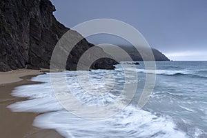 Waves break on Coumeenoole Beach