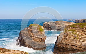 Waves break about rocks