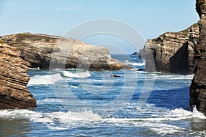 Waves break about rocks