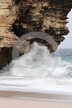 Waves breaking against rocks