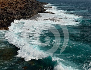 Waves breaking against the rocks