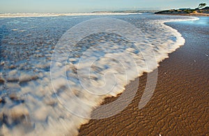 Waves breaking on beach