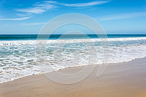 Waves breaking on beach with blue sky - Port Elizabeth, South Af