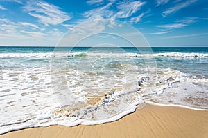 Waves breaking on beach with blue sky - Port Elizabeth, South Af