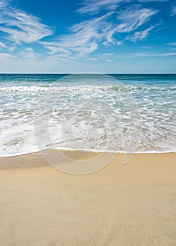 Waves breaking on beach with blue sky - Port Elizabeth, South Af