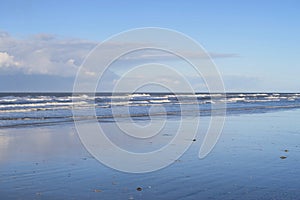 Waves are breaking on the beach Schiermonnikoog