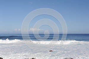 Waves breaking and crushing on the rocks on the Atlantic Ocean on coastline and seashore of Madeira Island , Portugal