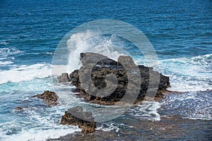 Waves breaking on Gris Gris Beach, Souillac, Mauritius photo