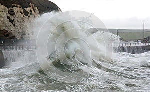 Waves Breaking over Newhaven Harbour Wall photo