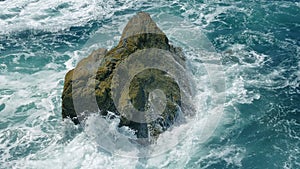 Waves Breaking Over Rock In The Sea