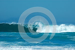 Waves breaking over rocks